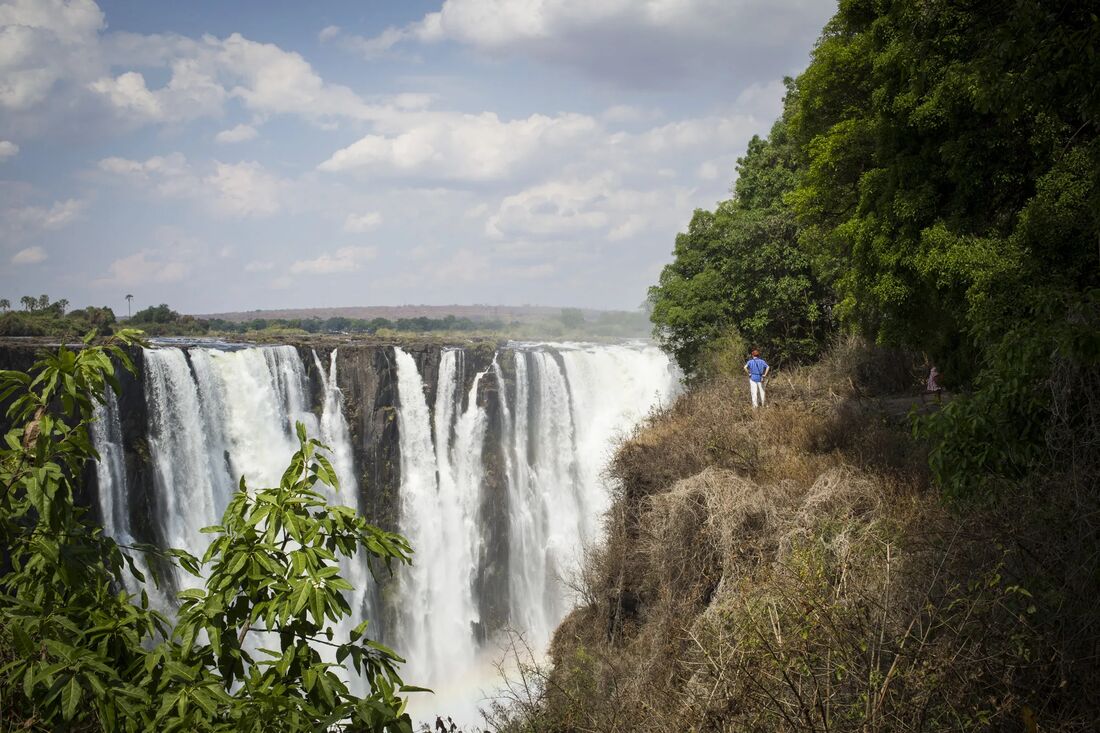 A traveler at the edge of Victoria Falls